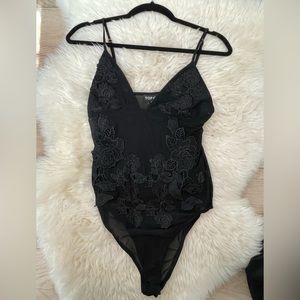Black mesh body suit with flower decal, worn once